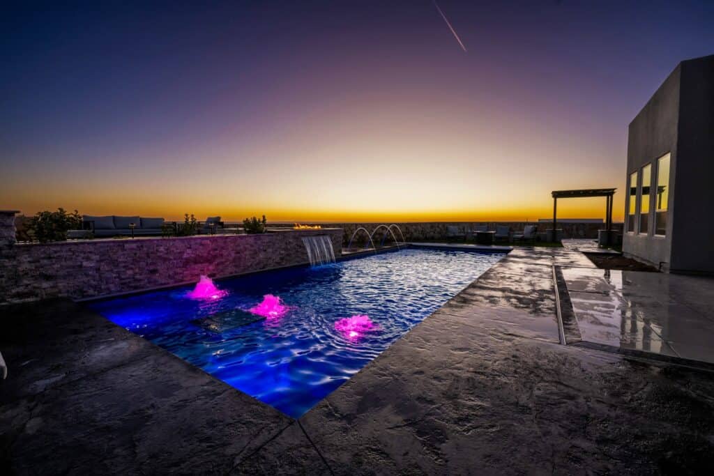Custom inground pool with fountains and sunset views in El Paso, TX